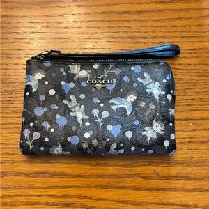 Cute Coach wristlet with designs.